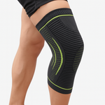 premium knee support compression sleeve in black with green accents